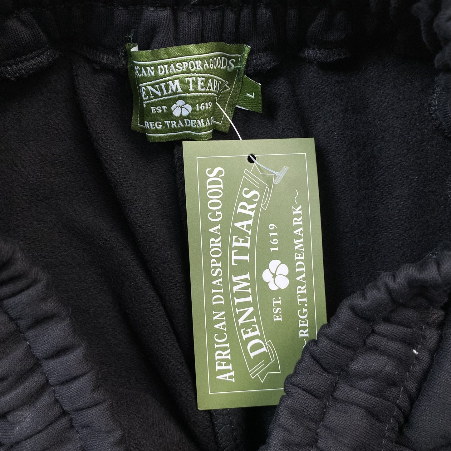 DENIM TEARS COTTON WREATH SWEATPANTS MONOCHROME BLACK