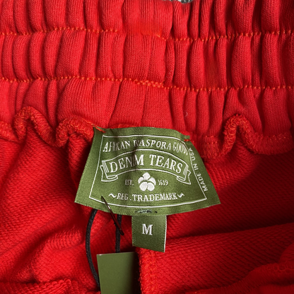 DENIM TEARS COTTON WREATH SWEATPANTS RED